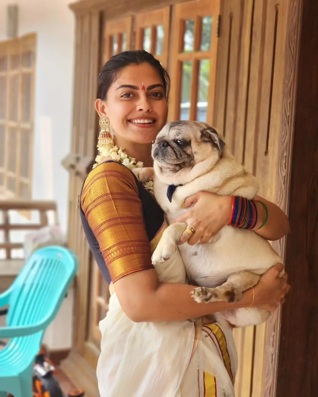 Anusree Nair Wearing Beautiful Earrings Jewellery White Saree Orange Blouse